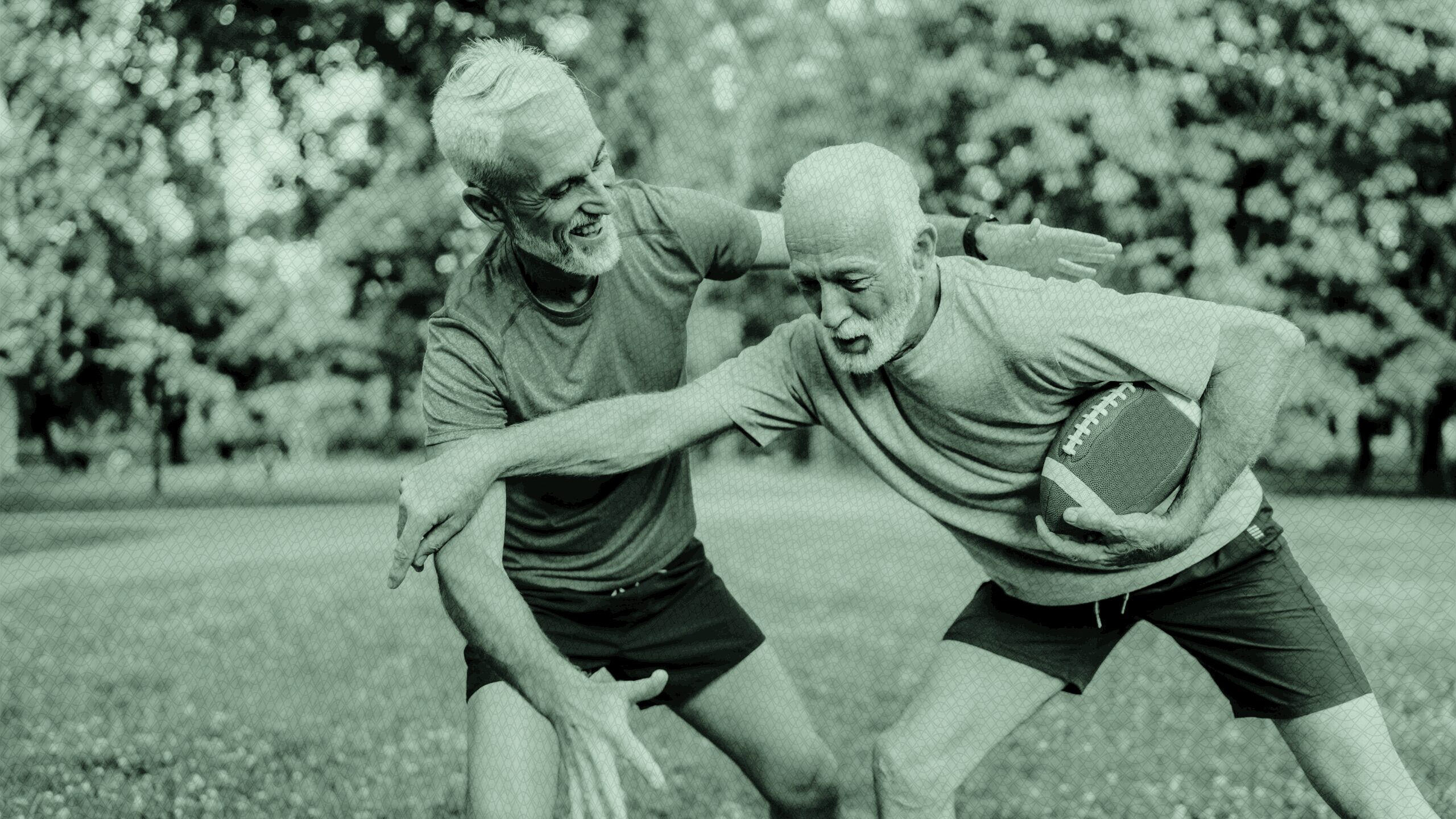 two older men playing football.