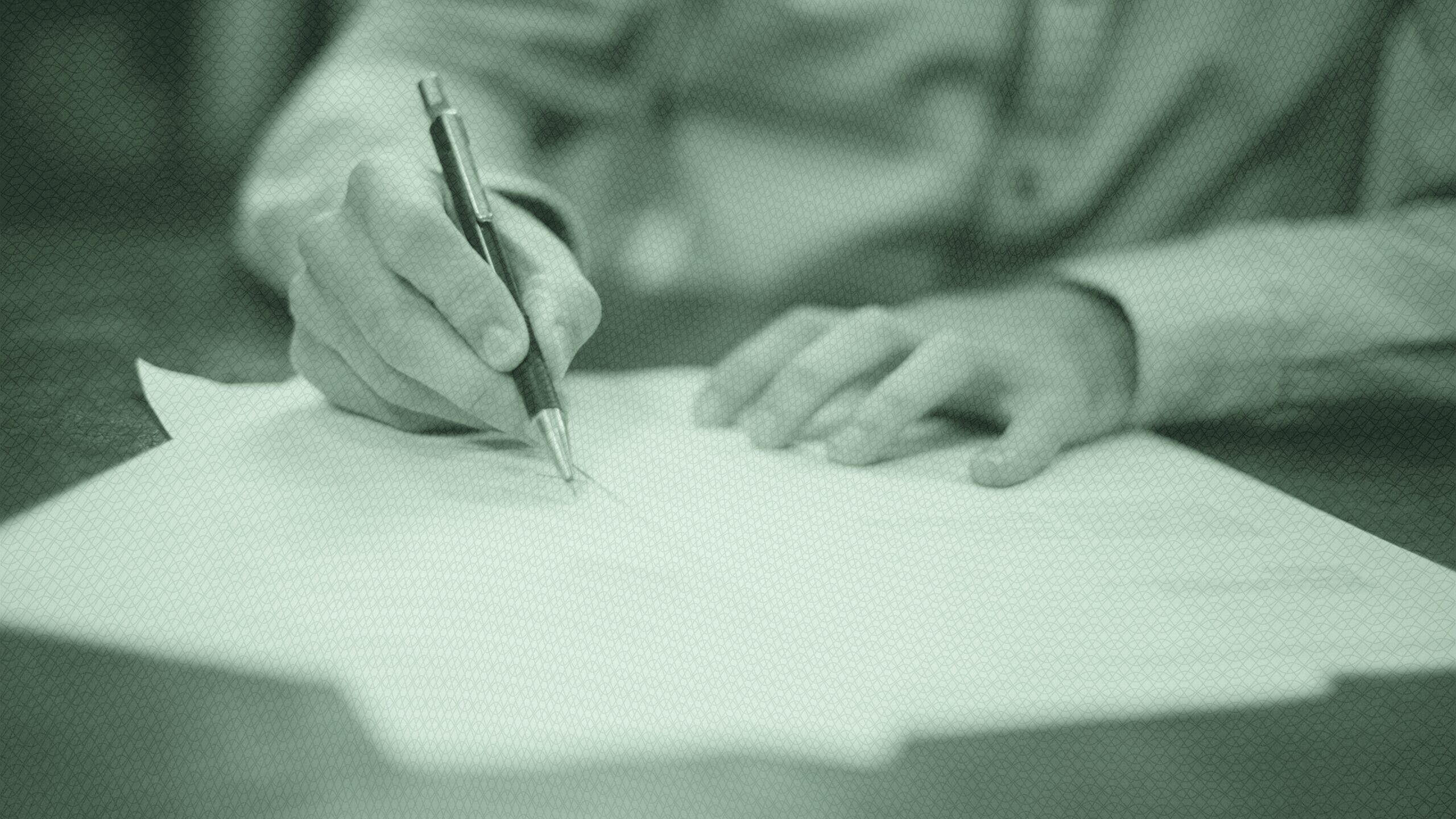 A man filling out forms.