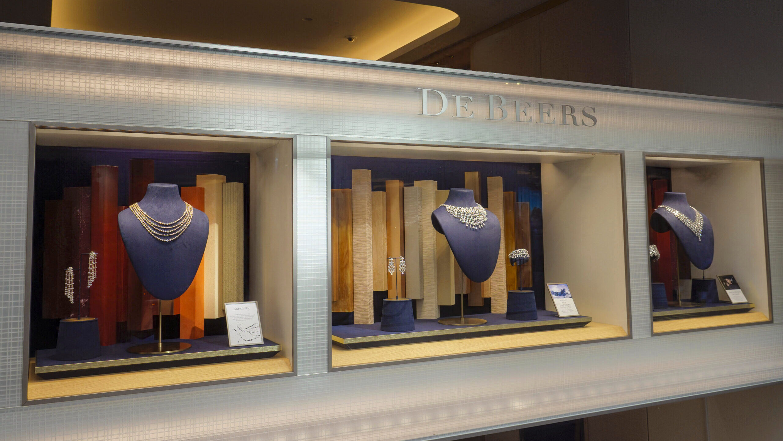 Photo of diamond necklaces at a De Beers shop.